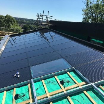 in roof solar panels being installed-min