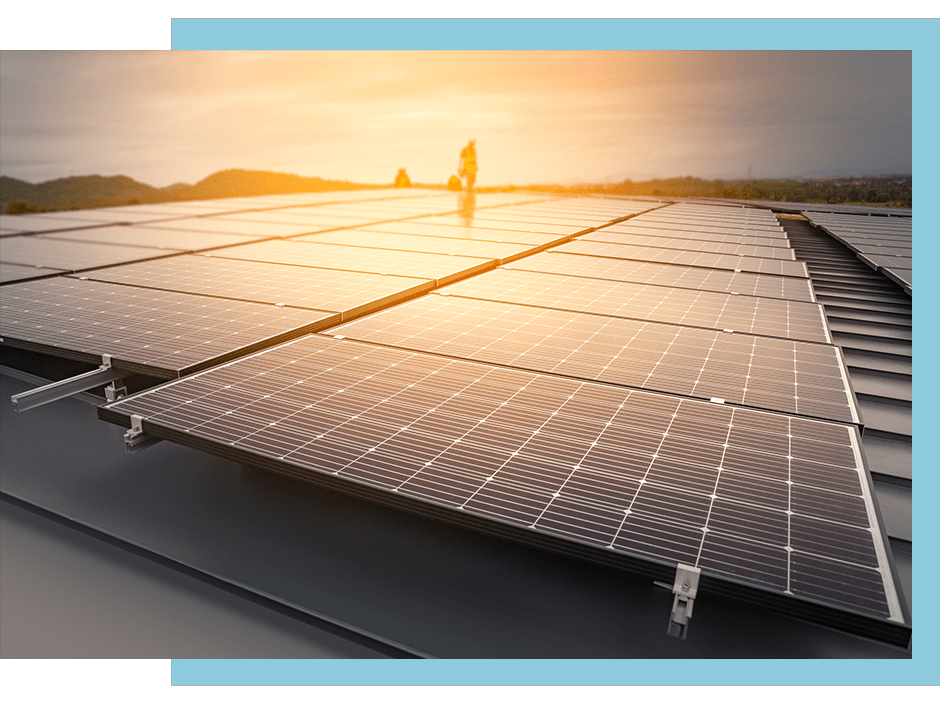 solar panels on facility roof in sunset