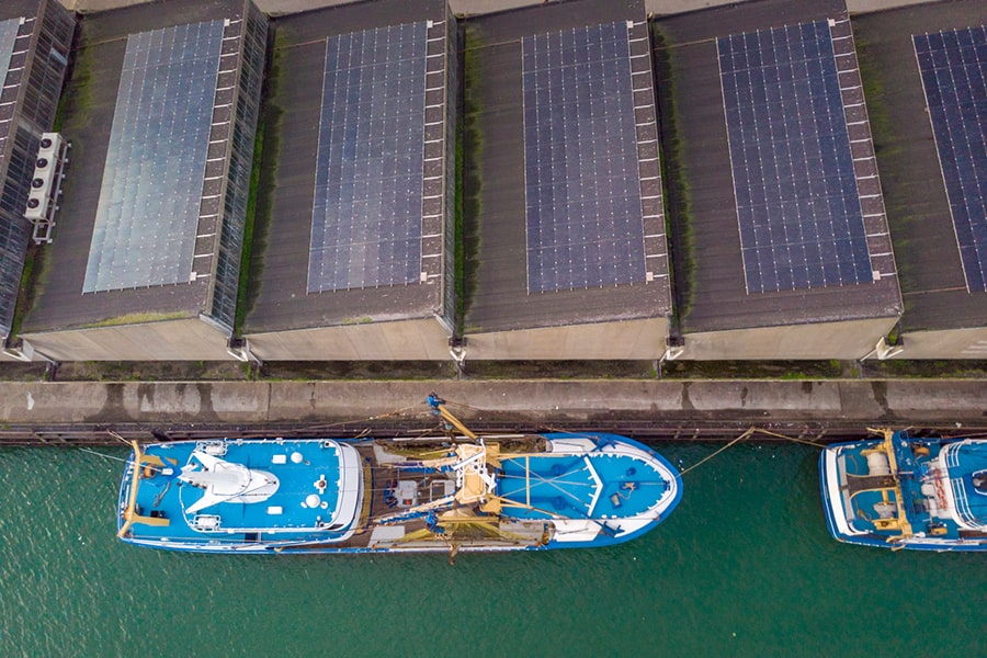 Solar Panels on a warehouse in a Harbor